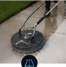 Pressure washing a concrete driveway