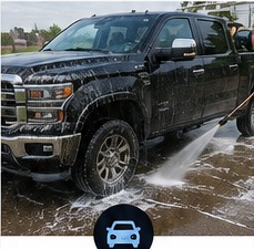 Pressure washing a pickup truck